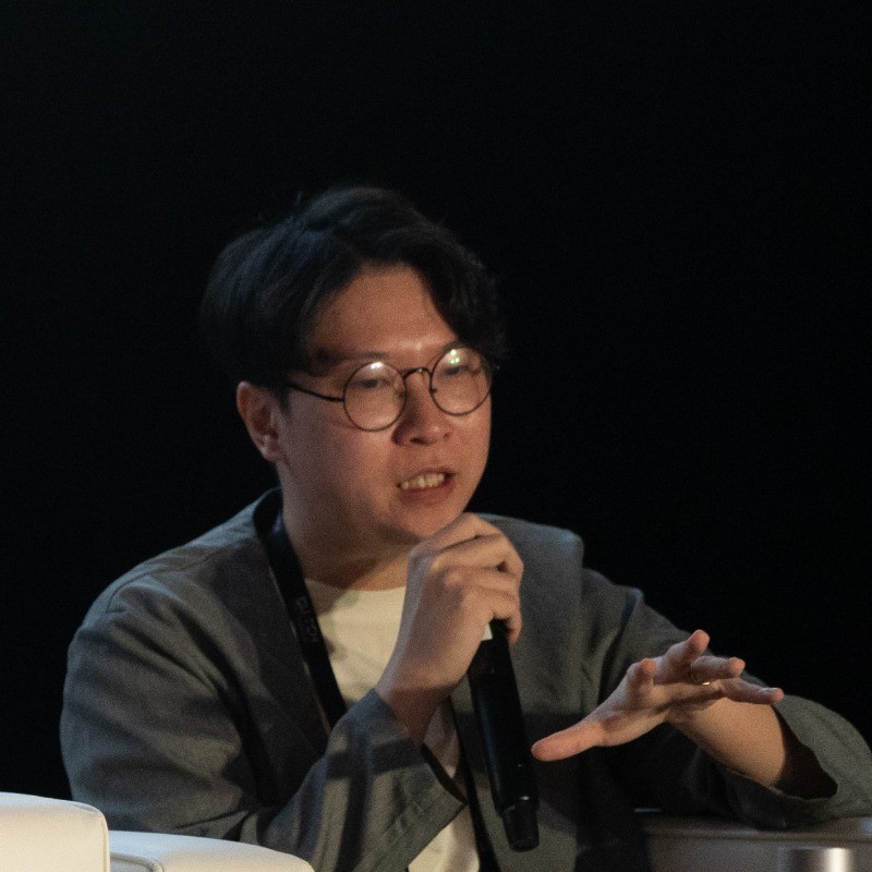 Louie Lui speaking on a panel